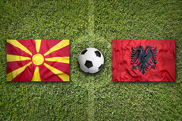 Image showing Macedonia vs. Albania flags on soccer field