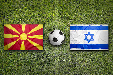 Image showing Macedonia vs. Israel flags on soccer field