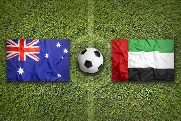 Image showing Australia vs. United Arab Emirates flags on soccer field