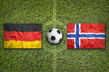 Image showing Germany vs. Norway flags on soccer field