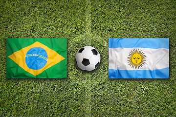 Image showing Brazil vs. Argentina flags on soccer field