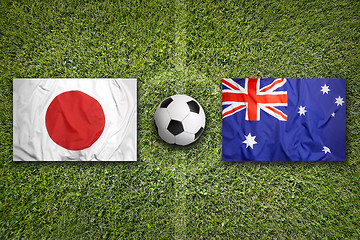 Image showing Japan vs. Australia flags on soccer field