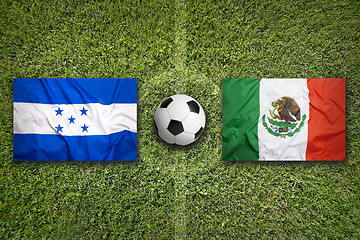 Image showing Honduras vs. Mexico flags on soccer field