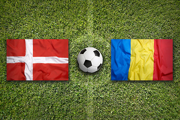 Image showing Denmark vs. Romania flags on soccer field