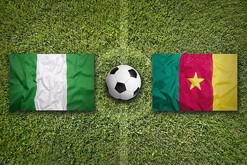 Image showing Nigeria vs. Cameroon flags on soccer field