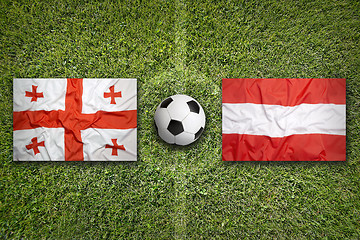 Image showing Georgia vs. Austria flags on soccer field