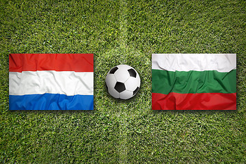 Image showing Netherlands vs. Bulgaria flags on soccer field