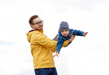 Image showing father with son playing and having fun outdoors