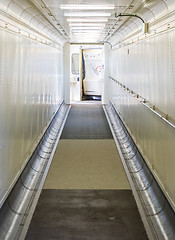 Image showing Jetway, walking towards the plane, selective focus