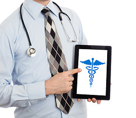 Image showing Doctor holding tablet - Caduceus symbol