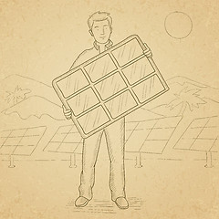 Image showing Man holding solar panel.