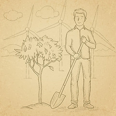 Image showing Man plants tree.