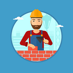 Image showing Bricklayer with spatula and brick.