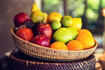 Image showing basket of fresh ripe juicy fruits at kitchen