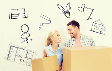 Image showing couple with delivery boxes moving to new home