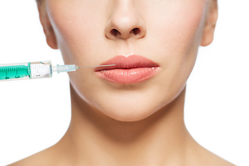 Image showing woman face and syringe making injection