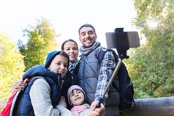 Image showing family with backpacks taking selfie and hiking