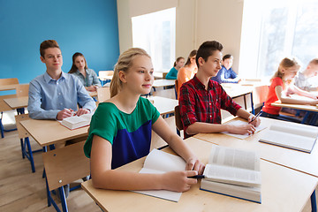 Image showing group of students with books at school lesson