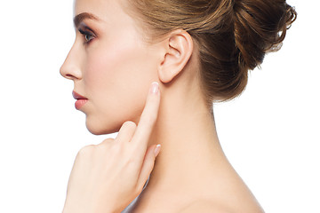 Image showing beautiful woman pointing finger to her ear