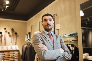 Image showing young man or businessman in suit at clothing store