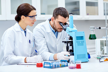 Image showing young scientists making test or research in lab