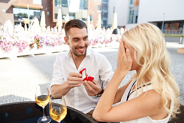 Image showing man with engagement ring making proposal to woman