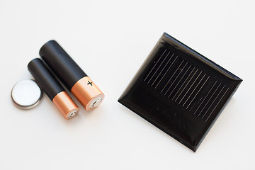 Image showing close up of alkaline batteries and solar cell