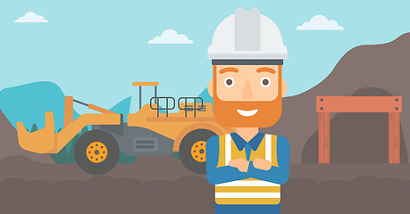 Image showing Miner with mining equipment on background.