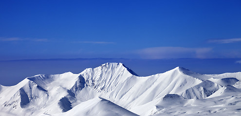 Image showing Panoramic view on snow mountains and blue sky