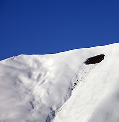 Image showing Trace of avalanche on off-piste slope in sunny day