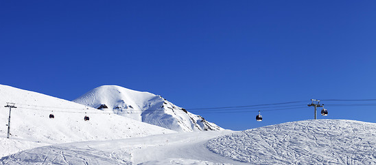 Image showing Panoramic view on gondola lift and ski slope at nice day