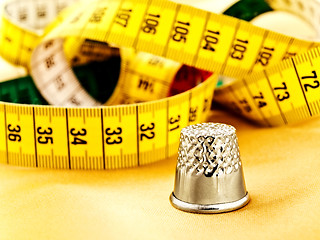 Image showing Measuring Tape And Thimble