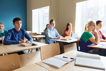 Image showing group of students with books at school lesson