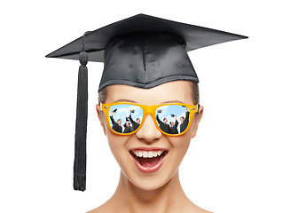 Image showing happy teenage girl in shades and mortarboard hat