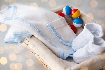 Image showing close up of baby clothes for newborn boy in basket