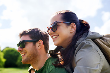 Image showing happy couple with backpacks having fun outdoors