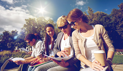 Image showing group of happy students with notebooks and coffee