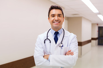 Image showing smiling doctor in white coat at hospital