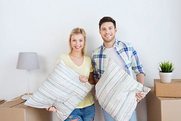 Image showing happy couple with stuff moving to new home