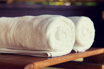 Image showing rolled bath towels at hotel spa