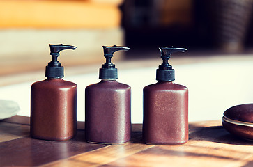 Image showing liquid soap or body lotion set at hotel bathroom