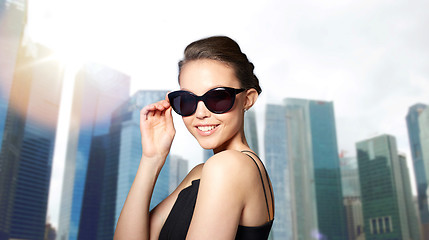 Image showing beautiful young woman in elegant black sunglasses