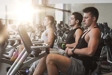 Image showing men working out on exercise bike in gym