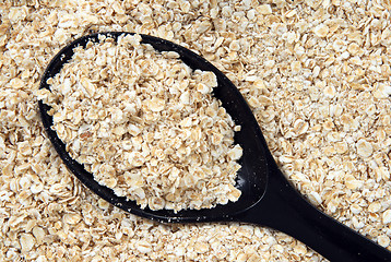 Image showing Rolled oats in a spoon