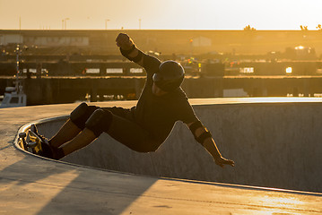 Image showing Skateboarder in a concrete pool 