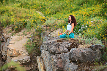 Image showing Young woman is practicing yoga