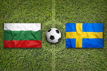 Image showing Bulgaria vs. Sweden flags on soccer field