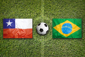 Image showing Chile vs. Brazil flags on soccer field