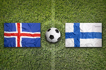 Image showing Iceland vs. Finland flags on soccer field