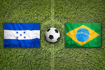 Image showing Honduras vs. Brazil flags on soccer field